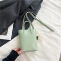 Minimalist light green leather tote bag with top handles and adjustable crossbody strap - Green Without Pendant