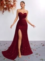 Detail of burgundy sequin evening gown showing the pleated bust and high-slit fishtail cut - Burgundy