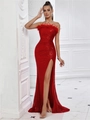 Detailed shot of red sequin evening gown featuring feather neckline and side slit design - Red