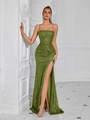 Detail view of emerald green sequin evening gown featuring side slit and high waist fold - XS / Verdant