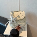Detail of cream quilted mini bag with silver star studs and large star charm - Beige With Pendant