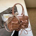 Pink PU leather handbag with decorative bows and polka dot scarf wrapped on the handle - Pink