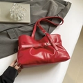 Chic red pleated leather tote bag with decorative belt buckle and adjustable shoulder strap - Red