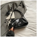 Detail of black pleated patent leather bag with star charms and detachable shoulder strap - With Pendant / Black