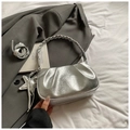 Detail of silver pleated crossbody bag with star charm on grey blazer and white bedding - With Pendant / Silver