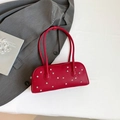Red leather shoulder bag with star rivets and vintage textured finish for women - Red
