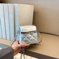 Detail of silver metallic quilted bag with crystal studs and metal clasp closure - Silver