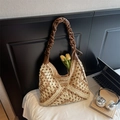 Detail of hand-woven straw tote with geometric patterns and leather bow shoulder strap - Beige & Khaki