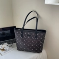 Large dark grey printed tote bag with deer pattern and black leather straps shown with laptop - Black