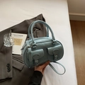 Light blue faux leather handbag with two front buckle pockets and adjustable strap - Blue
