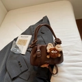 Dark brown lychee pattern leather crossbody bag with cute monster plush charm decoration - Brown with Pendant
