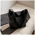 Detail of minimalist tote bag with contrast textures and adjustable silver buckle strap - Black