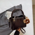 Chocolate brown lychee pattern tote bag with gold hardware and plush monster charm - Coffee with Pendant