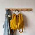 Mochila minimalista con cordón amarillo jengibre y asa tejida para un estilo urbano - Amarillo