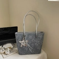 Blue tote bag with floral patterns, silver strap, and star charm for daily commute - With Charm / Light Blue