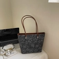 Dark gray floral print tote bag with brown leather handles on office desk scene - No Pendant / Dark Blue
