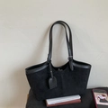 Detail of black suede tote bag with leather piping and adjustable metallic strap buckle - Black