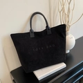 Minimalistische schwarze Cord-Tragetasche mit TOTE BAG-Schriftzug und Ledergriffen - Schwarz