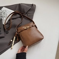 Minimalist vintage dark brown leather shoulder bag with gold clasp and beaded tassel charm - With Pendant / Brown