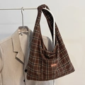 Retro dark brown plaid canvas tote bag with wide shoulder strap and leather brand patch - Brown