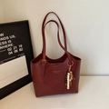 Chic burgundy leather tote bag with elegant beaded charm and golden brand logo - Wine Red (With Pendant)