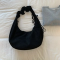 Minimalist black crescent shoulder bag with pleated strap and drawstring detail - Black
