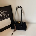 Chic black frosted leather underarm bag with golden zipper and brand tag detail - Black with Pendant