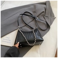 Minimalist black woven leather baguette bag with silver chain strap and smooth texture finish - Black