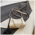 Chic cream woven crossbody bag with silver chain strap and minimalist pillow shape design - White