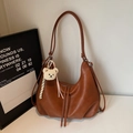 Brown faux leather crescent tote bag with long strap and plush bear keychain charm - With Charm / Brown