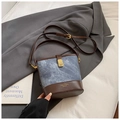 Blue denim and brown leather bucket bag with gold metal clasp and adjustable strap - Blue Without Charm
