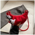 Red croissant crescent bag in suede texture featuring a cute dalmatian doll charm and strap - Red with Pendant