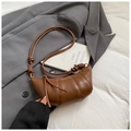 Chic brown leather croissant bag with knotted strap on a professional gray blazer - Coffee without Pendant