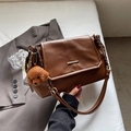 Brown vintage faux leather tote bag with metal chain strap and a plush puppy charm - Brown with Pendant