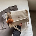 Chic beige tote bag with litchi texture gold chain strap and brown puppy charm - Beige With Charm