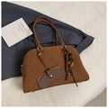 Detail of dark brown matte leather Boston bag with decorative tassel and round handles - Brown with Pendant
