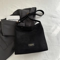 Black faux suede shoulder bag with adjustable strap and vintage gold metal hardware - Black