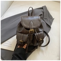 Detail of dark brown leather backpack with retro buckles and British college style design - Dark Coffee