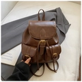 Detail of vintage dark brown faux leather backpack with metallic buckles and front pockets - Light Coffee