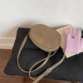 Detail of olive green suede crossbody bag with adjustable strap and vintage silver buckle - Green