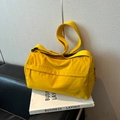 Minimalist bright yellow waterproof nylon tote bag with wide shoulder strap - Yellow