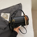 Minimalist black crossbody bag with vintage wooden bead charm and golden hardware detail - With Charm / Black