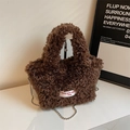 Brown faux shearling bucket bag with silver ball chain strap and spirit free patch - Brown
