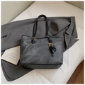 Dark grey marble textured tote bag with black straps and golden hardware accessories - Black