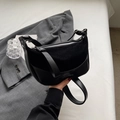 Minimalist black half-moon shoulder bag in matte leather and suede finish with silver zipper - Black