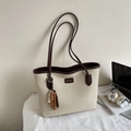 Chic cream canvas tote bag with dark brown leather trim and stylish beaded tassel detail - Style With Charm / Off White