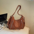 Brown leather large capacity tote bag with silver zippers and stylish long tassels - Brown