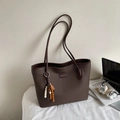 Brown faux leather tote bag with stylish tassel charm and minimalist metal nameplate - Style With Charm / Coffee