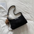 Minimalist black matte suede shoulder bag for women with a brown plush star charm - Black