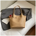 Minimalist woven straw bucket bag in beige with slim leather straps and decorative charms - Khaki with Pendant